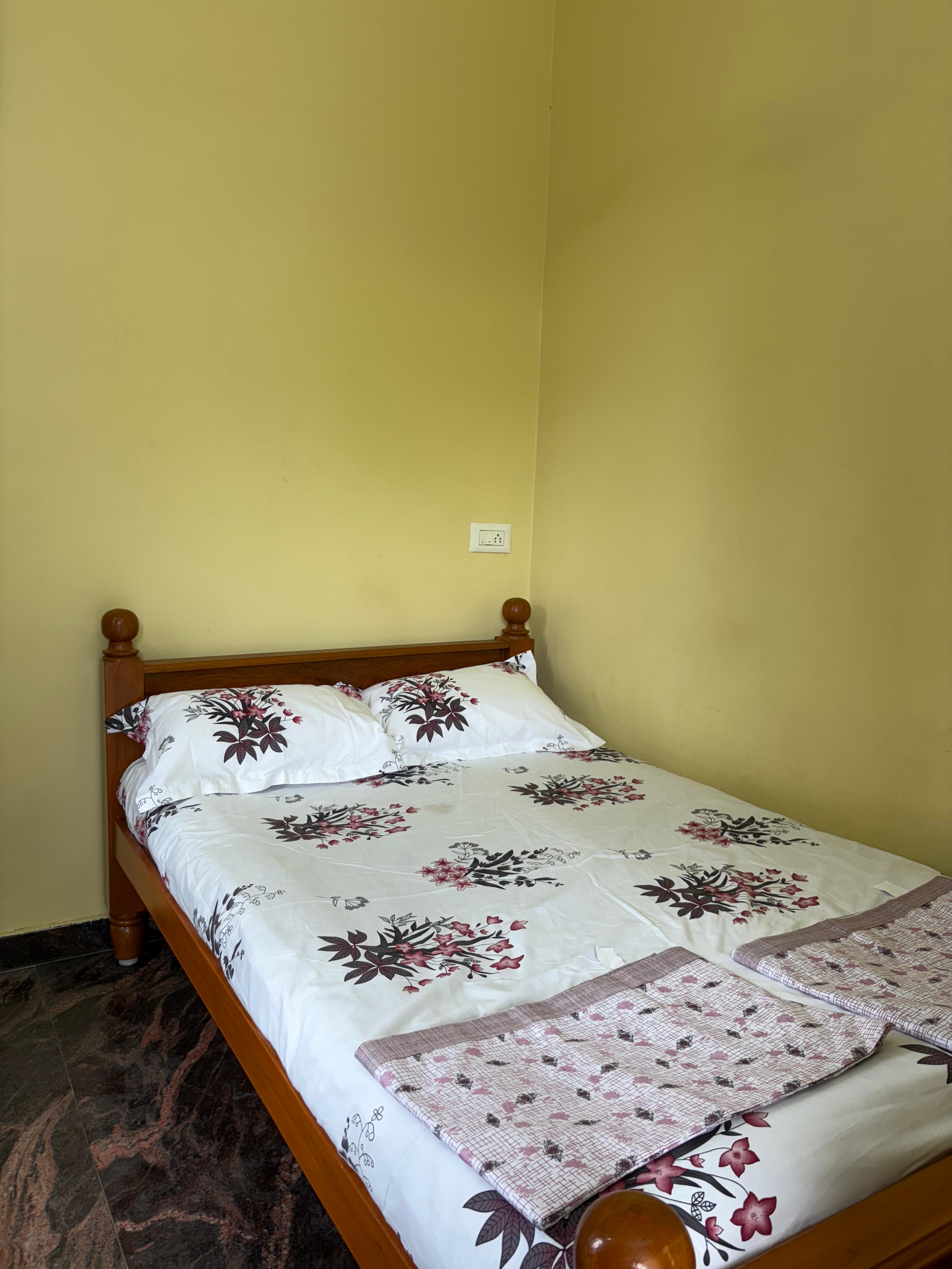 Cosy bedroom with wooden double bed